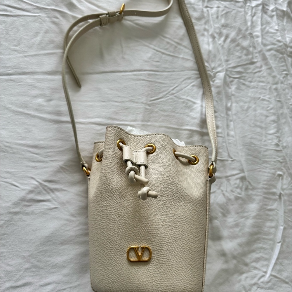Valentino Garavani Cream Leather Drawstring Crossbody